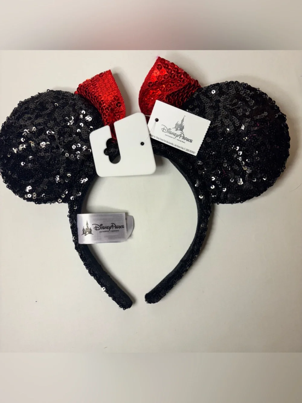 Official Disney Parks Sequin Minnie Mouse Ear Headband with Red Bow